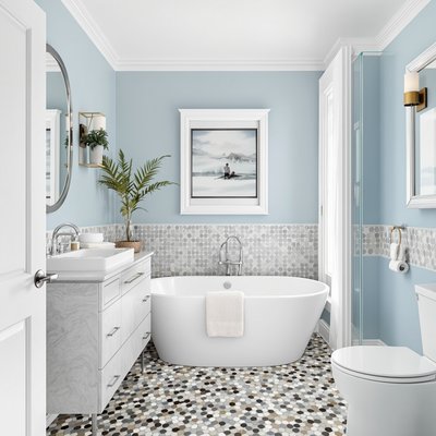 Spa-inspiriertes Badezimmer mit Kieselmosaikboden und ruhigen blauen Wänden